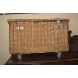 Two handled wicker linen basket on wheels. (B.P. 24% incl.