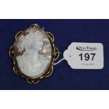 A large shell cameo brooch set in pinchbeck. (B.P. 24% incl.