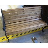 Garden bench with oak slats and cast iron supports. (B.P. 24% incl.