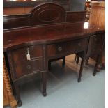 Early 20th Century mahogany serpentine fronted sideboard on square tapering legs and spade feet.