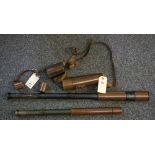 Two military telescopes in leather cases,