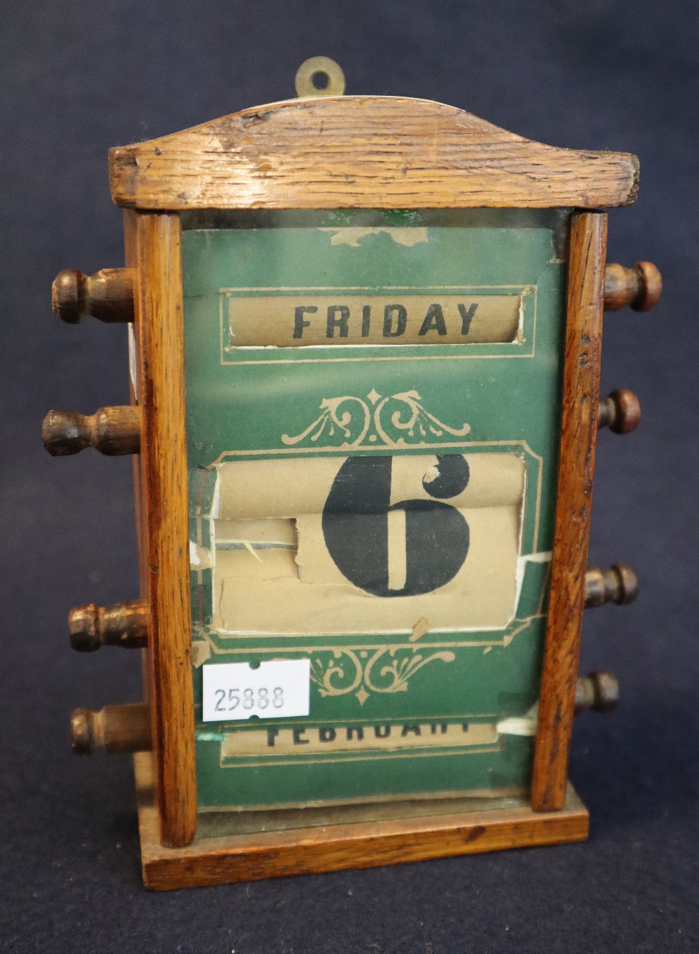 Early 20th Century oak desk calendar with arched top and turned adjustment knobs. (B.P. 24% incl.