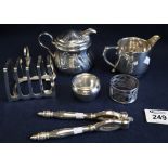Bag of assorted silver plated items to include; two cream jugs, nutcrackers, serviette ring,