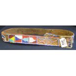 A leather beaded belt with multicolour geometric designs, probably Native American. (B.P. 24% incl.