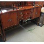 Edwardian mahogany serpentine fronted sideboard on square tapering legs and spade feet. (B.P.