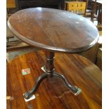 19th Century mahogany tilt top table of oval form, standing on tripod base. (B.P. 24% incl.