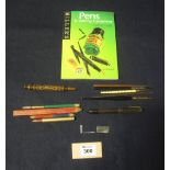 Assorted writing instruments to include; various pens including an olive wood carved souvenir pen,