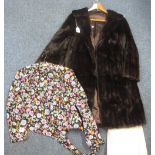 A sheer vintage floral print bolero and a dark brown knee length vintage fur coat with blue roses