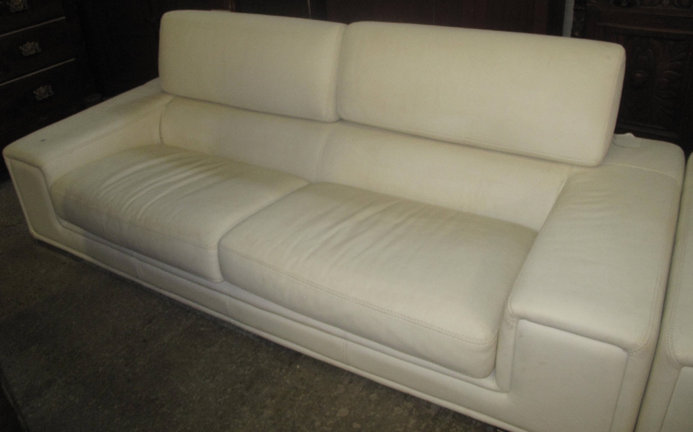 Large white Italian leather two seater settee with chrome mounts. (B.P. 24% incl.