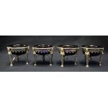 Set of four 925 continental silver empire style open high salts with mask mounts and paw feet and