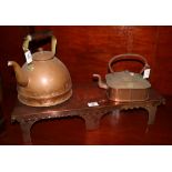 Two copper saucepans and a brass stand. (3) (B.P. 24% incl.