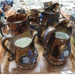 Tray of copper lustre dresser jugs and similar items. (B.P. 24% incl.