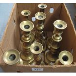 Box containing assorted brass baluster candlesticks. (B.P. 24% incl.