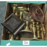 Box of assorted metalware, mainly brass candlesticks, copper chamber stick etc.