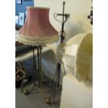 Heavy brass standard lamp on triform base with shade,