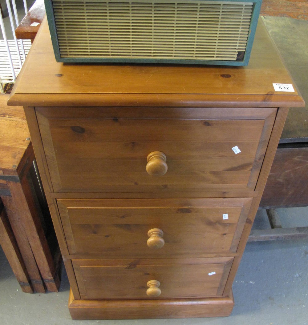 Good quality modern pine narrow straight front chest of three drawers with turned handles on a