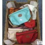 Collection of five fabric Longchamp style soap bags with leather trim and two similar purses.