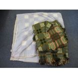 Two vintage green ground Welsh tapestry blankets with fringed edges.