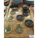 Tray of assorted metalware including; horse brasses, wall masks,
