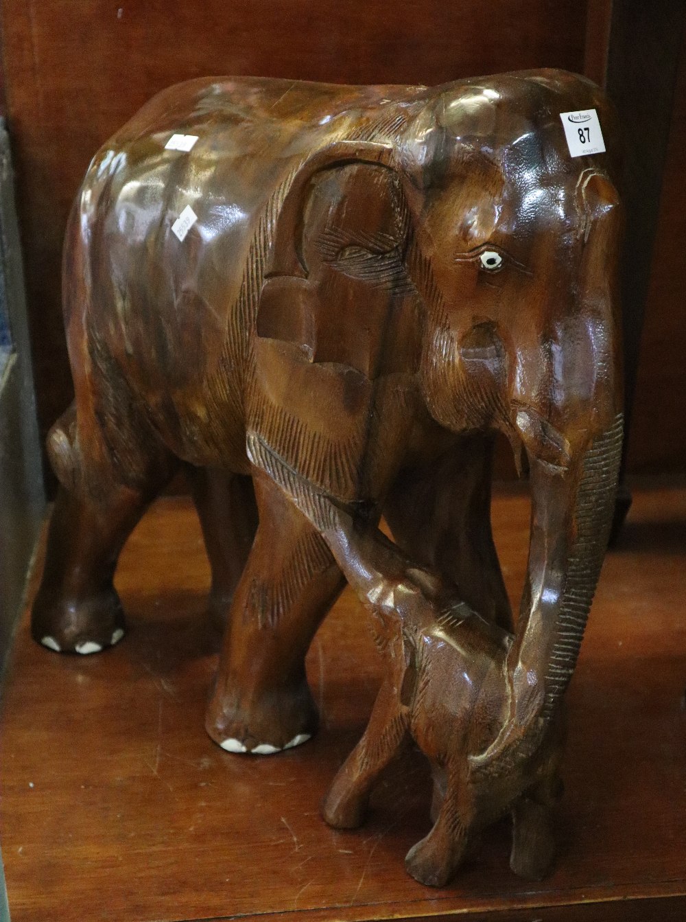 Large carved hardwood study of an Indian elephant with her calf. 49cm high approx. (B.P. 24% incl.