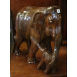 Large carved hardwood study of an Indian elephant with her calf. 49cm high approx. (B.P. 24% incl.