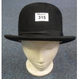 Black vintage bowler fur felt hat marked 'Moores British Made' and 'The Zephyrus' to the inside rim.