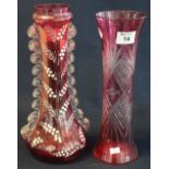 A cranberry flash cut waisted glass vase with geometric decoration,
