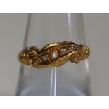 An 18ct gold and diamond ring. (B.P. 24% incl.