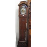 Edwardian style walnut three train grandmother clock with silver chapter ring and Roman numerals.