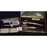 Tin of assorted writing instruments, biros etc. (B.P. 24% incl.