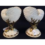Two similar Royal Worcester porcelain Nautilus shell vases,
