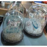 A garniture of three spun glass sailing ship groups on circular wooden bases, two with glass domes.