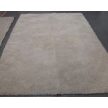 Large rectangular cream ground modern shag pile type rug. (B.P. 24% incl.