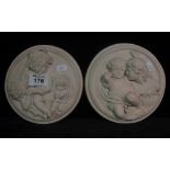 Two modern circular plaster wall plaques depicting semi nude children. (2) (B.P. 24% incl.