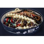 A box of assorted beads and costume jewellery. (B.P. 24% incl.