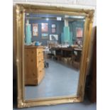 Modern gilt and foliate framed bevel plate mirror. (B.P. 24% incl.