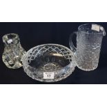 Three items of assorted glassware to include; moulded glass straight sided jug with bark finish,