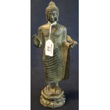 Indonesian type cast bronze standing Buddha figure with right hand raised and holding the hem of