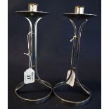 Pair of plated metal Art Deco design open frame candlesticks with broad drip pans,