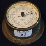 Small bulkhead type Shortland Smiths brass cased barometer. 10cm diameter approx. (B.P. 24% incl.