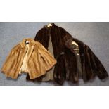 Two vintage mink fur jackets; one blonde and one dark brown.