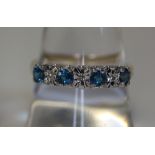 A 9ct gold ring set with blue topaz and diamond. Weight 2.6g approx. (B.P. 24% incl.