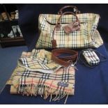 Collection of Burberry style items to include; two cashmere and wool scarves, a hat, a belt,