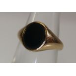 A 9ct gold signet ring set with a bloodstone. Weight 4.3g approx. (B.P. 24% incl.