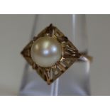 A yellow metal and pearl ring. Approx weight 3.2g. (B.P. 24% incl.