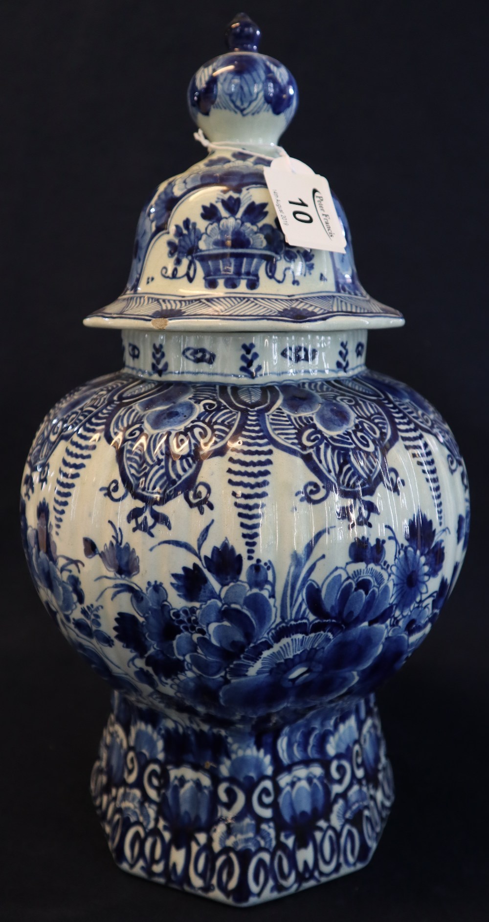 Early 20th Century Delft blue and white hand painted baluster shaped vase and cover.