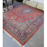 20th Century Persian design red ground foliate carpet. 360 x 259cm approx. (B.P. 24% incl.