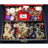 Cantilever jewellery case containing a quantity of costume jewellery, beads etc. (B.P. 24% incl.