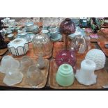 Four trays of assorted glass lamp shades, coloured glass, opaline glass, varying forms etc. (B.P.