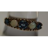 9ct gold dress ring with opals and blue stones. Weight 2.3g approx. (B.P. 24% incl.